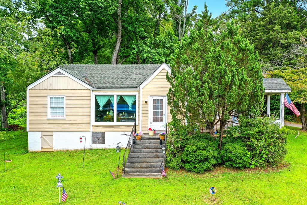 1003 East Church Street Jasper, GA 30143 - Photo 2 of 27 a front view of a house with a yard