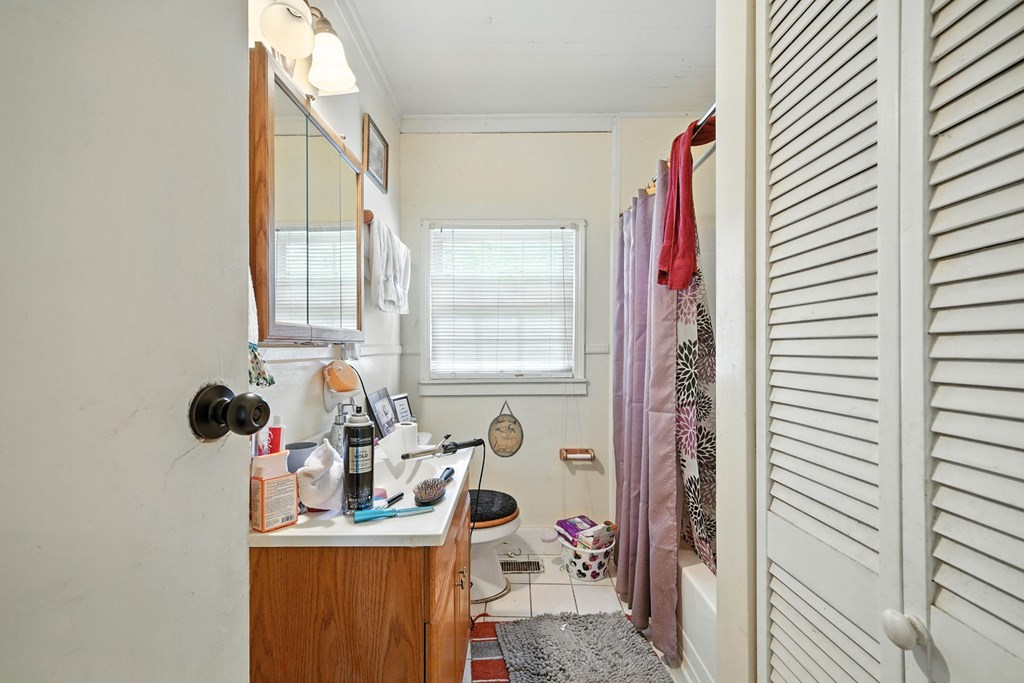 1003 East Church Street Jasper, GA 30143 - Photo 21 of 27 a bathroom with a sink and a window