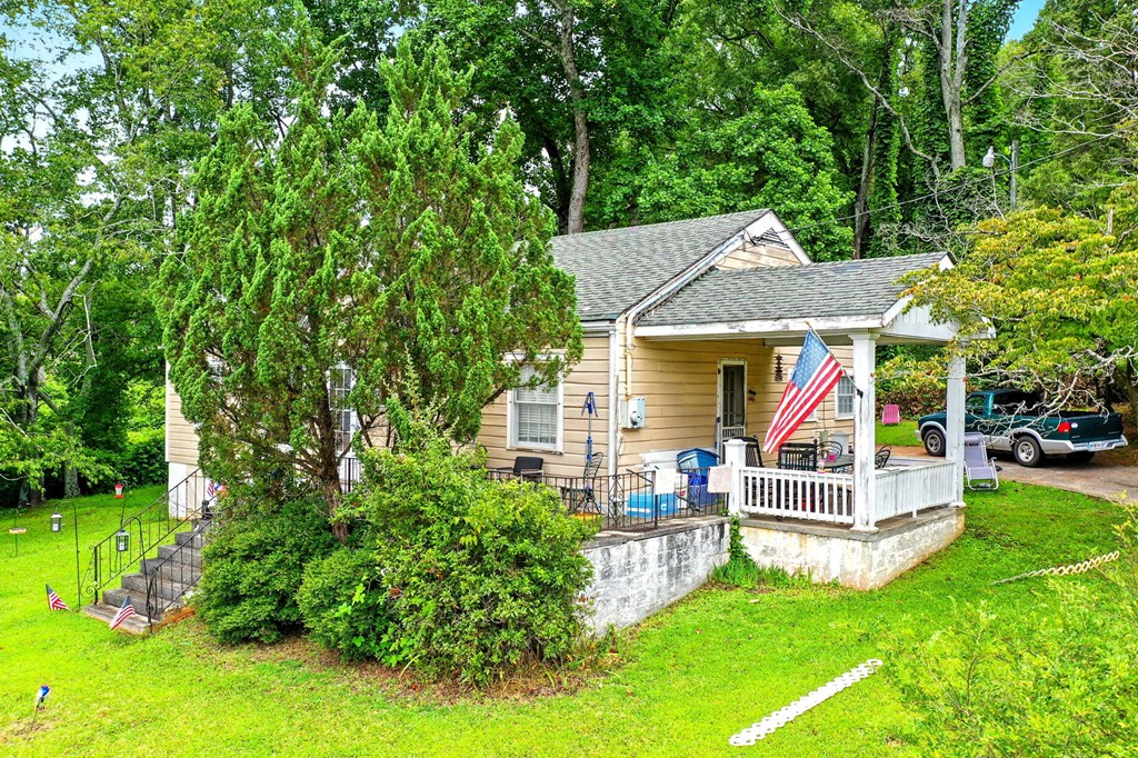 1003 East Church Street Jasper, GA 30143 - Photo 27 of 27 a view of house with swimming pool outdoor seating and trees
