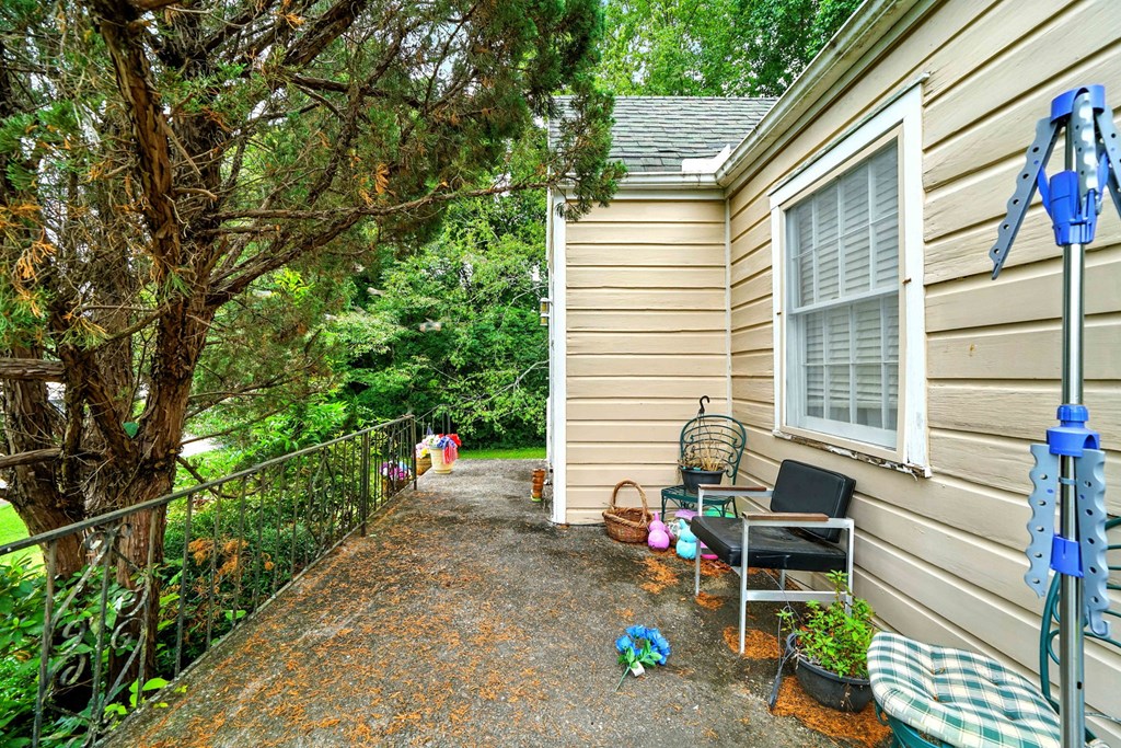 1003 East Church Street Jasper, GA 30143 - Photo 6 of 27 a backyard of a house with outdoor seating