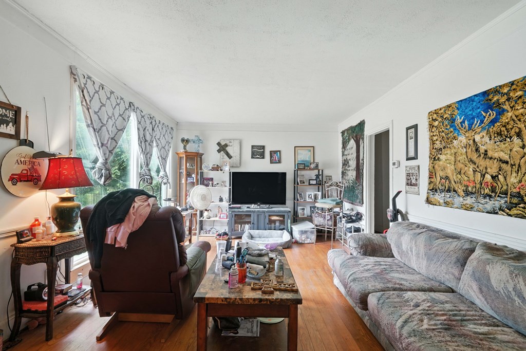 1003 East Church Street Jasper, GA 30143 - Photo 8 of 27 a living room with furniture and a flat screen tv