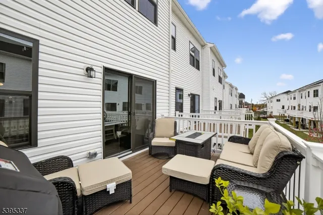 a view of a patio with couches chairs and potted plants