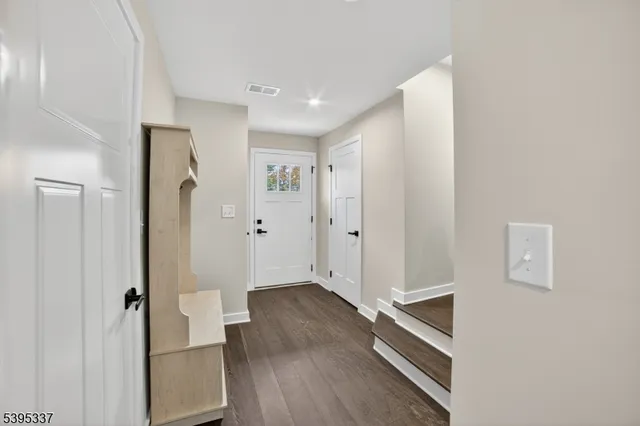 a view of entryway with wooden floor