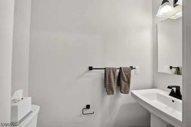 a bathroom with a sink and mirror