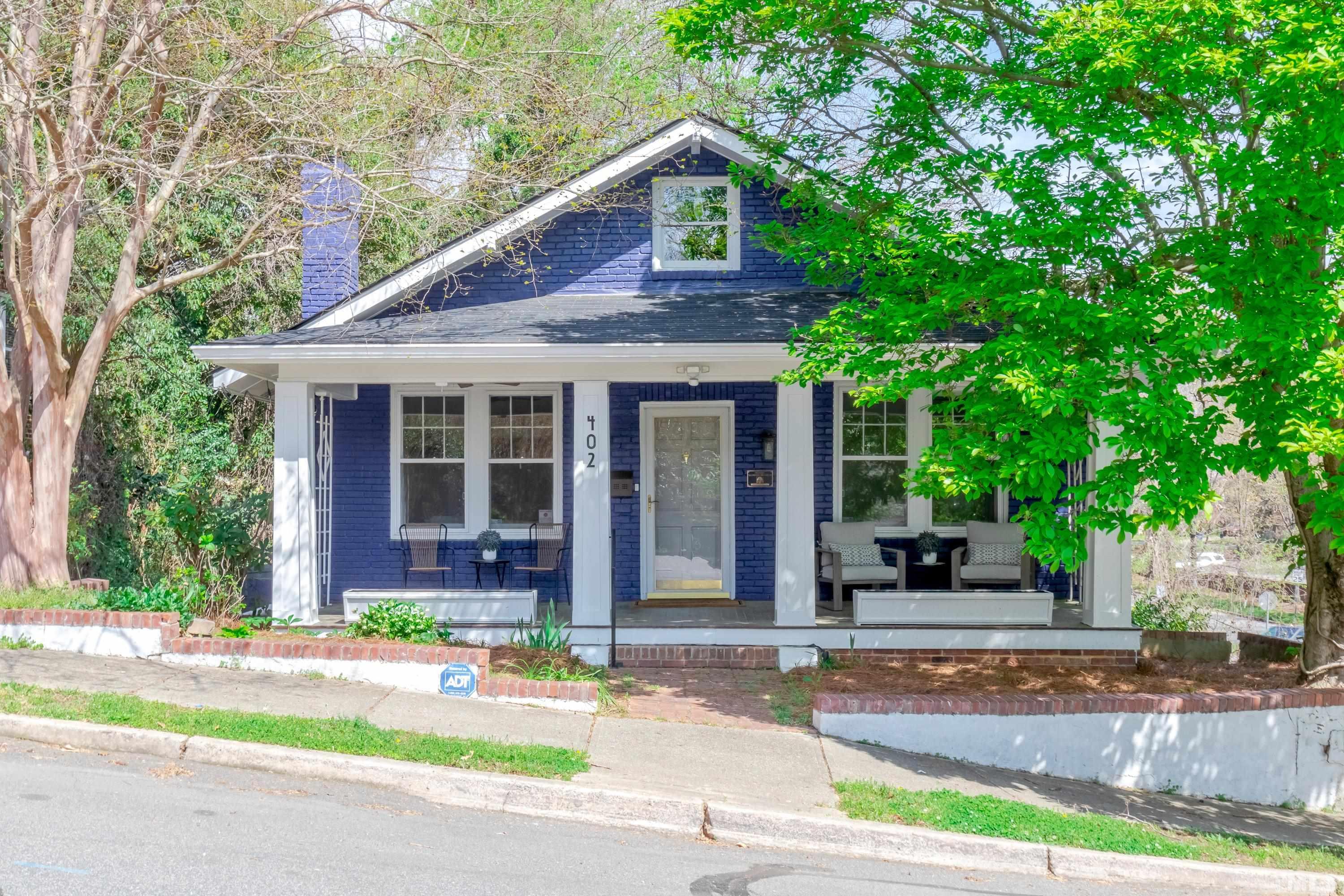 402 Cole Street Raleigh, NC 27605 - Photo 1 of 39 a front view of a house with a yard