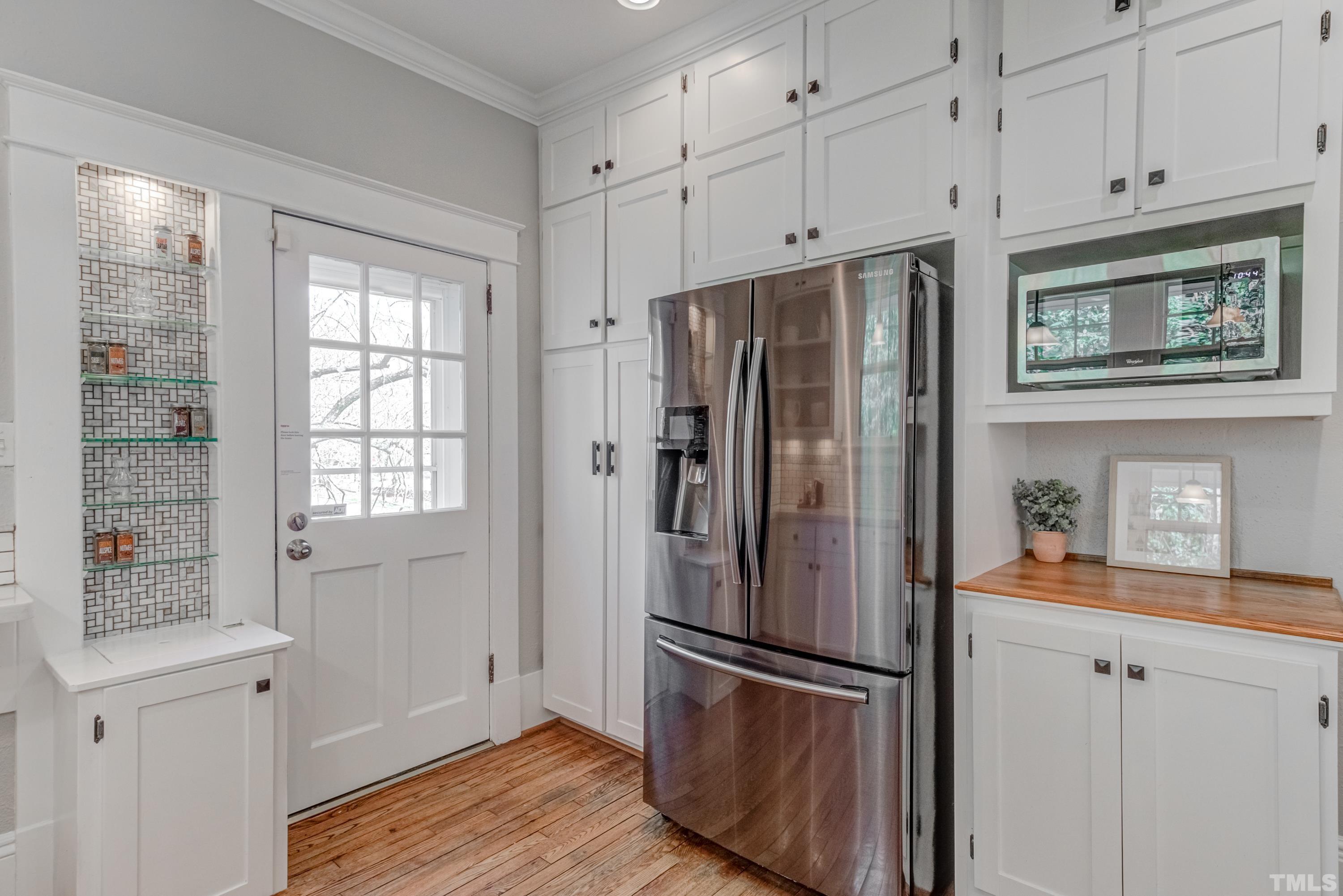 402 Cole Street Raleigh, NC 27605 - Photo 14 of 39 a metallic refrigerator freezer sitting in a kitchen