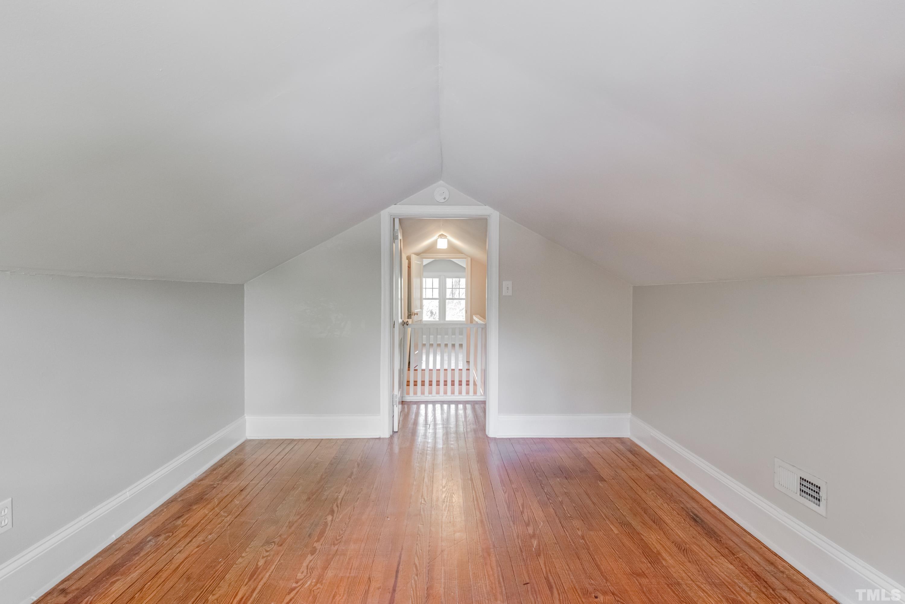 402 Cole Street Raleigh, NC 27605 - Photo 24 of 39 wooden floor in an empty room with a window