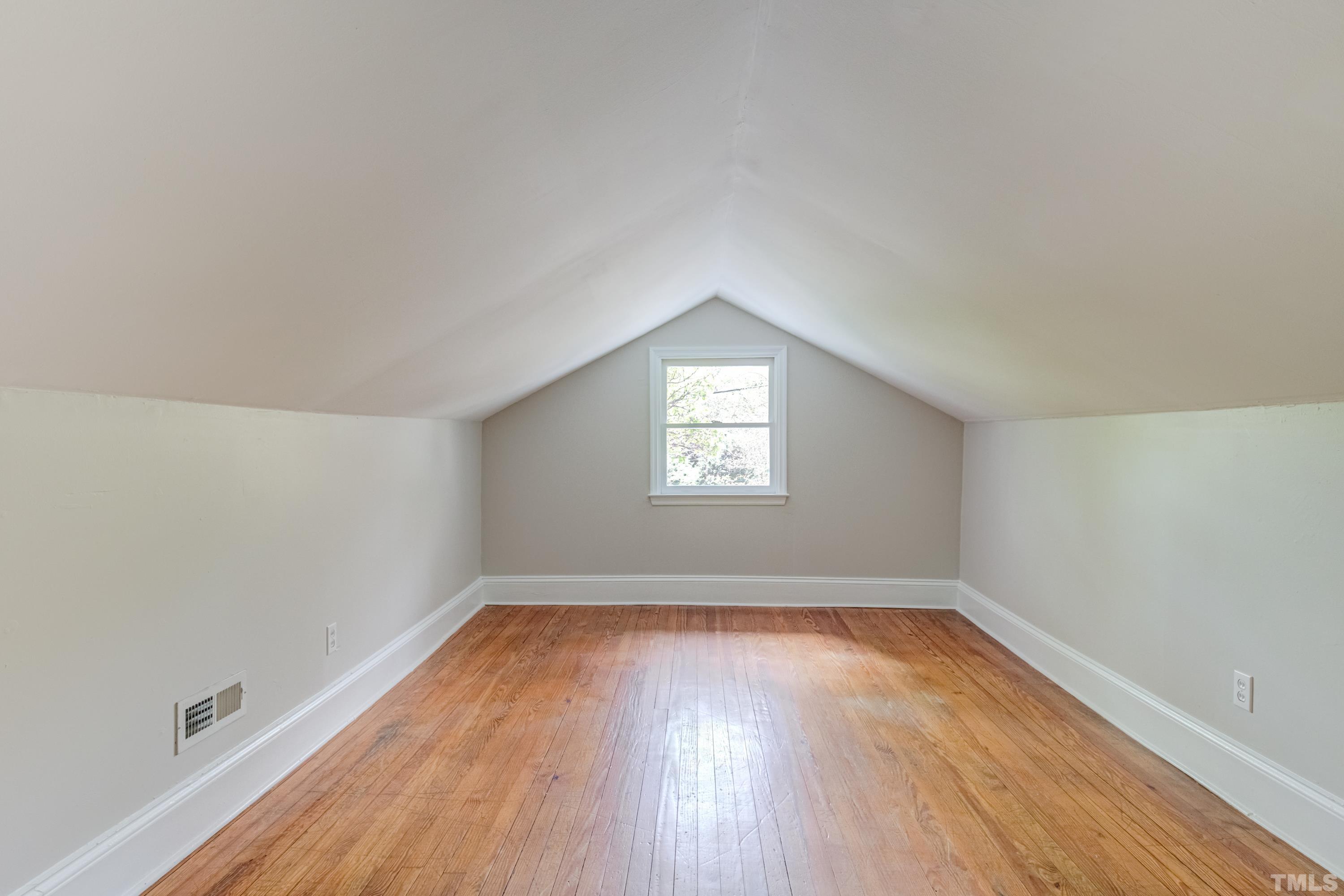 402 Cole Street Raleigh, NC 27605 - Photo 25 of 39 a view of a room with wooden floor and window
