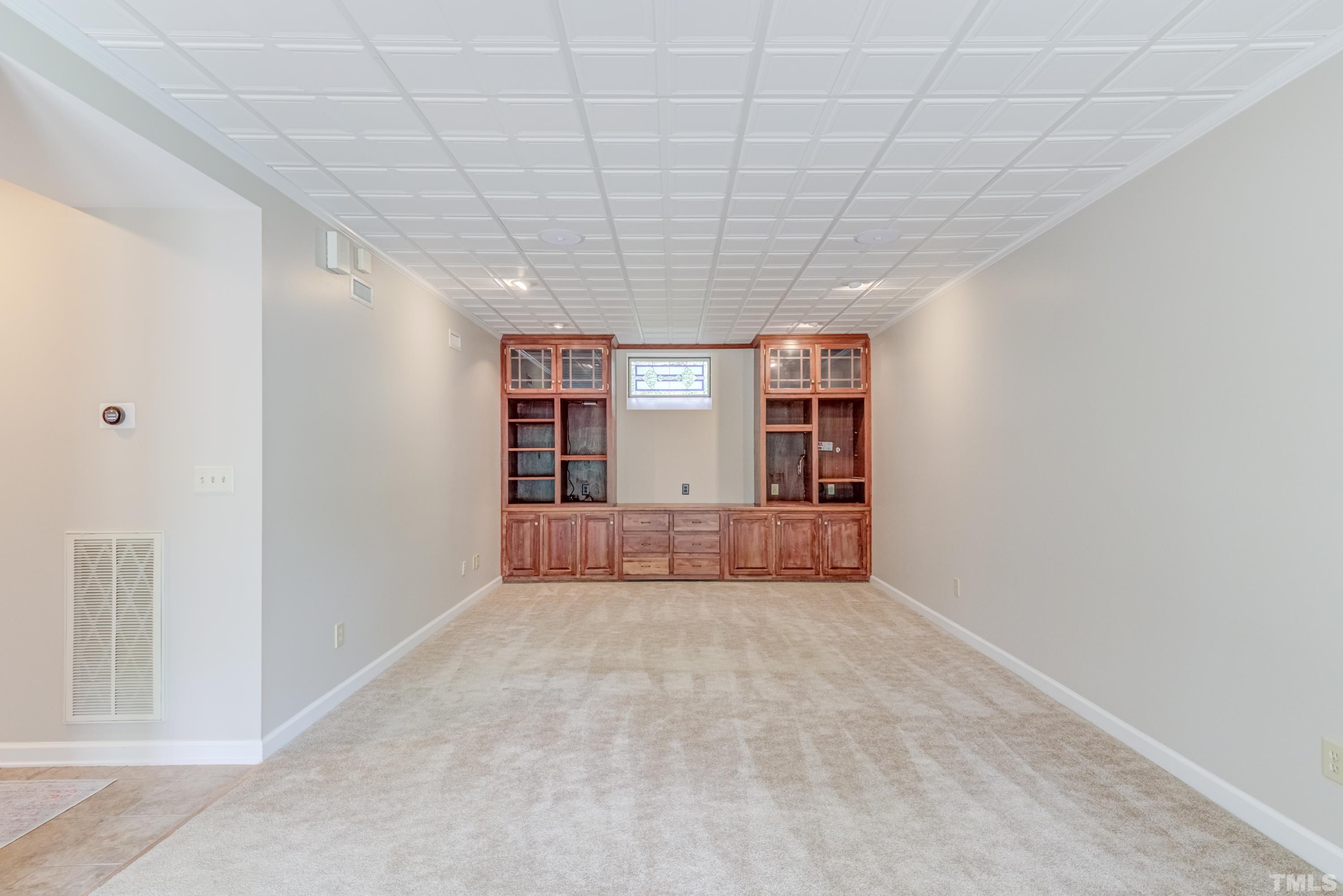 402 Cole Street Raleigh, NC 27605 - Photo 27 of 39 a view of an empty room with closet and kitchen view