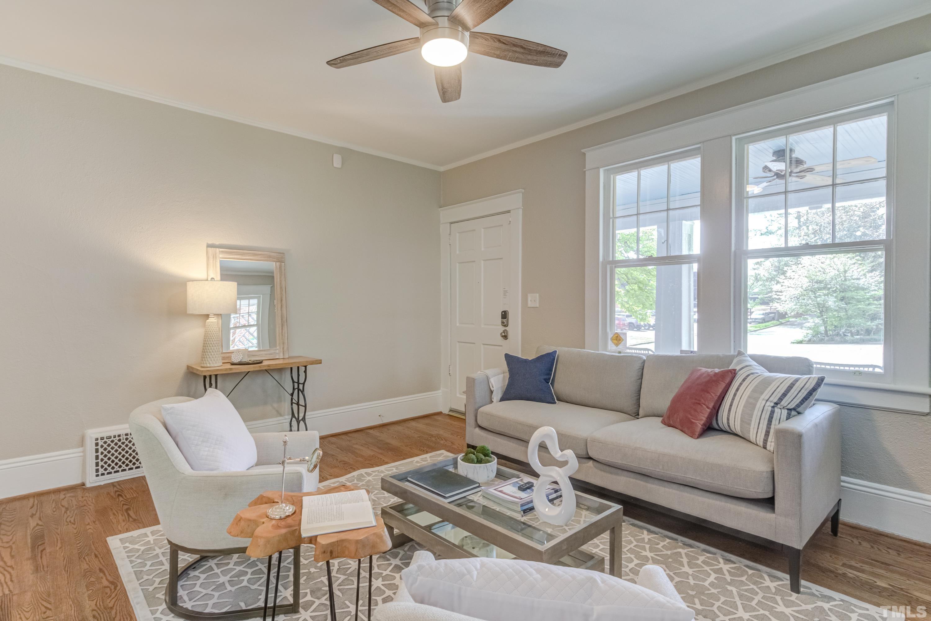 402 Cole Street Raleigh, NC 27605 - Photo 3 of 39 a living room with furniture and a large window