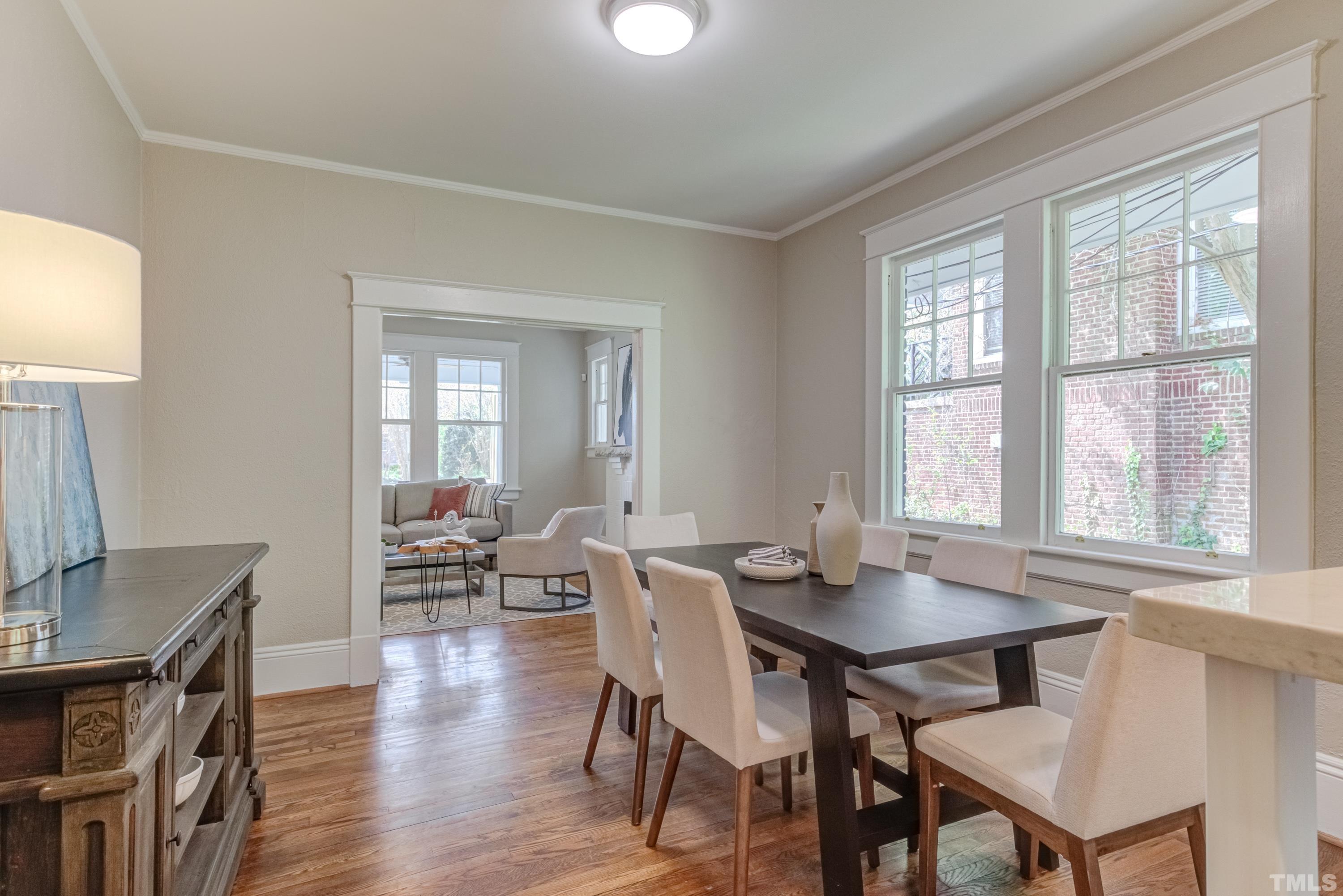 402 Cole Street Raleigh, NC 27605 - Photo 8 of 39 a view of a dining room with furniture and wooden floor