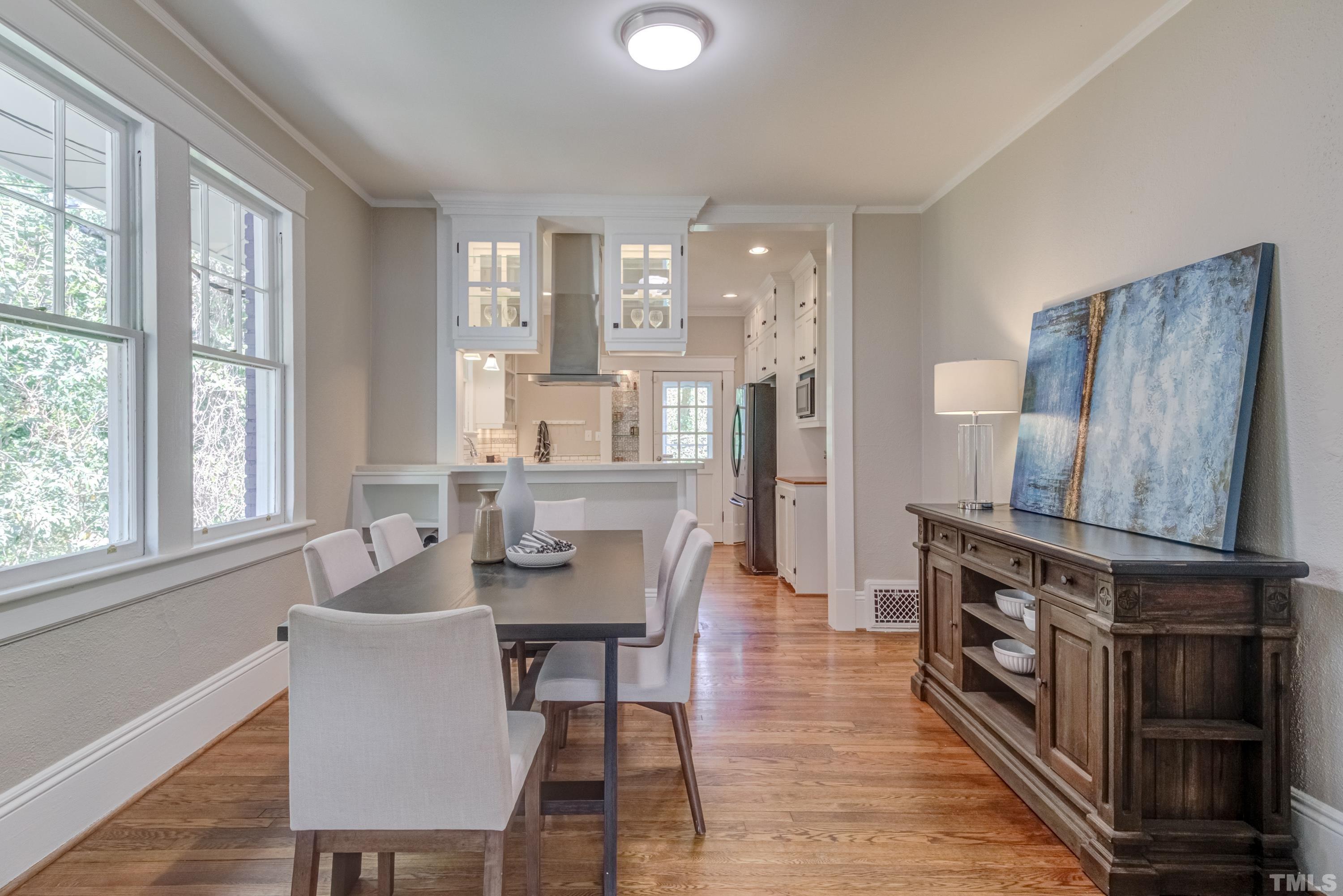 402 Cole Street Raleigh, NC 27605 - Photo 9 of 39 a dining room with furniture and wooden floor