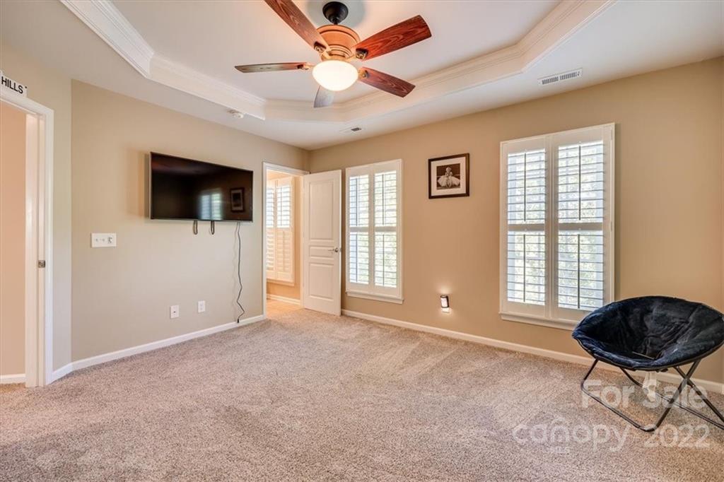 1112 Drayton Court Fort Mill, SC 29708 - Photo 22 of 27 a living room with furniture and a flat screen tv