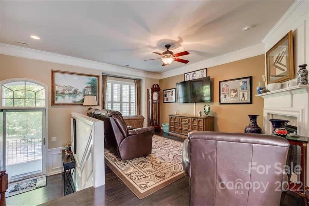 1112 Drayton Court Fort Mill, SC 29708 - Photo 6 of 27 a living room with furniture a flat screen tv and a large window