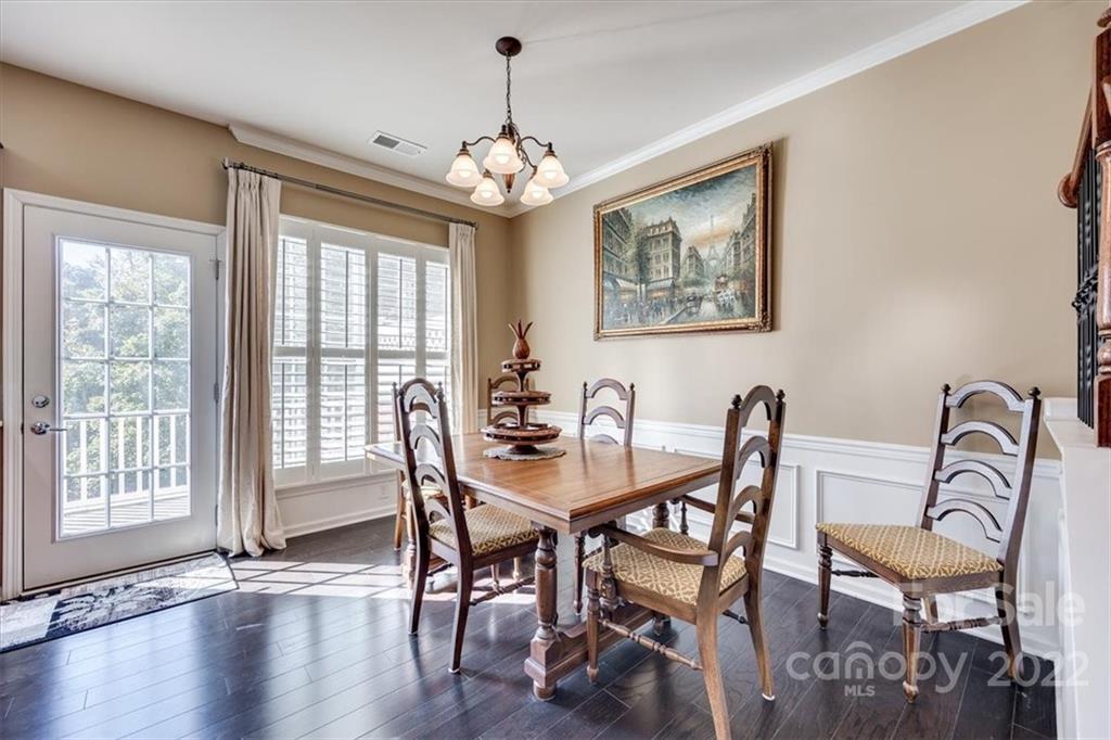 1112 Drayton Court Fort Mill, SC 29708 - Photo 10 of 27 a view of a dining room with furniture window and wooden floor
