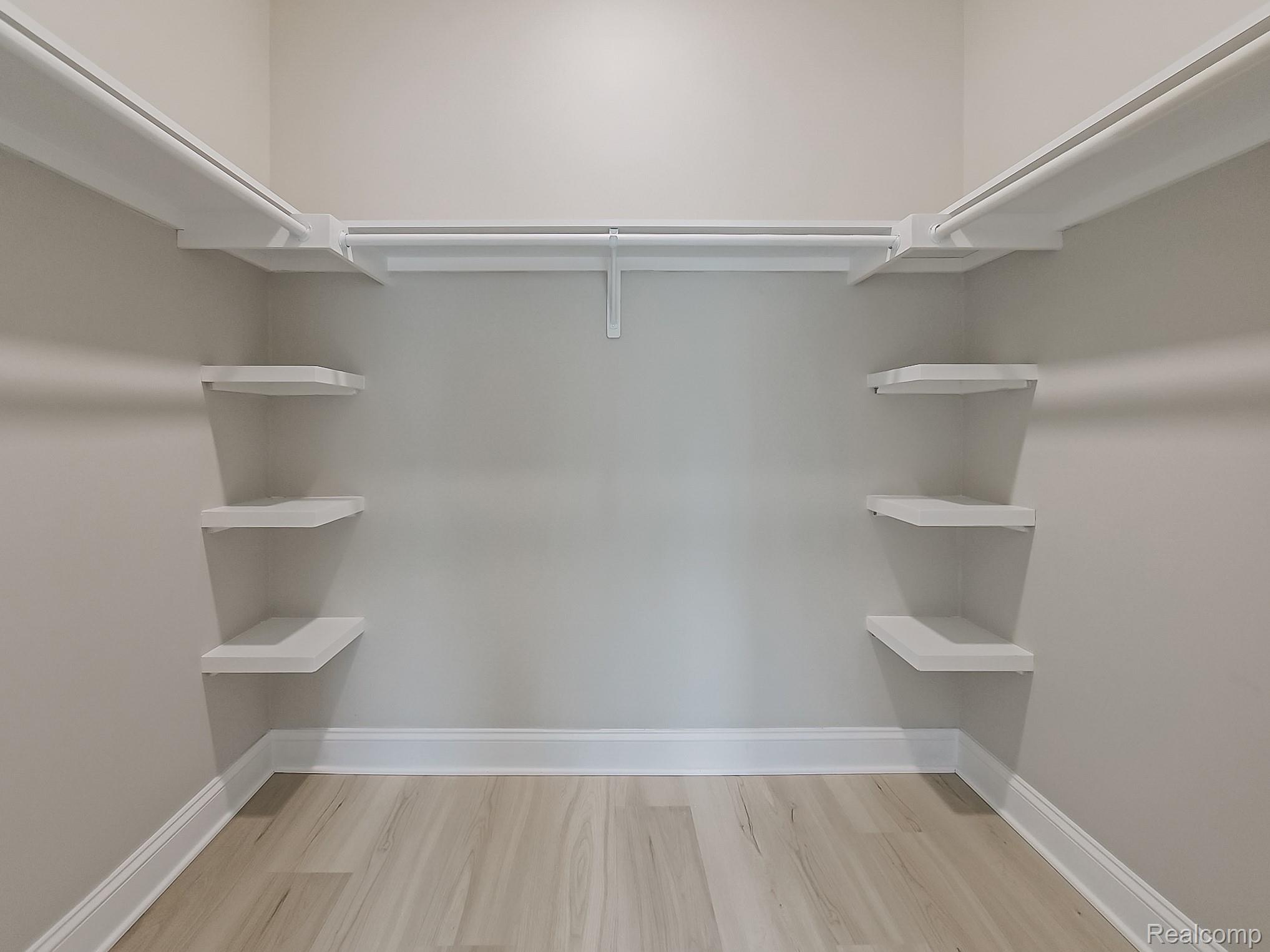 31480 Warren Road, Unit 101 Westland, MI 48185 - Photo 13 of 26 Spacious closet featuring light wood finished floors