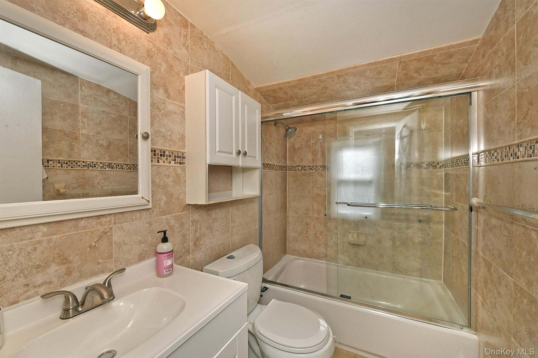 25 Lincoln Road North Plainview, NY 11803 - Photo 12 of 13 a bathroom with a sink toilet and shower