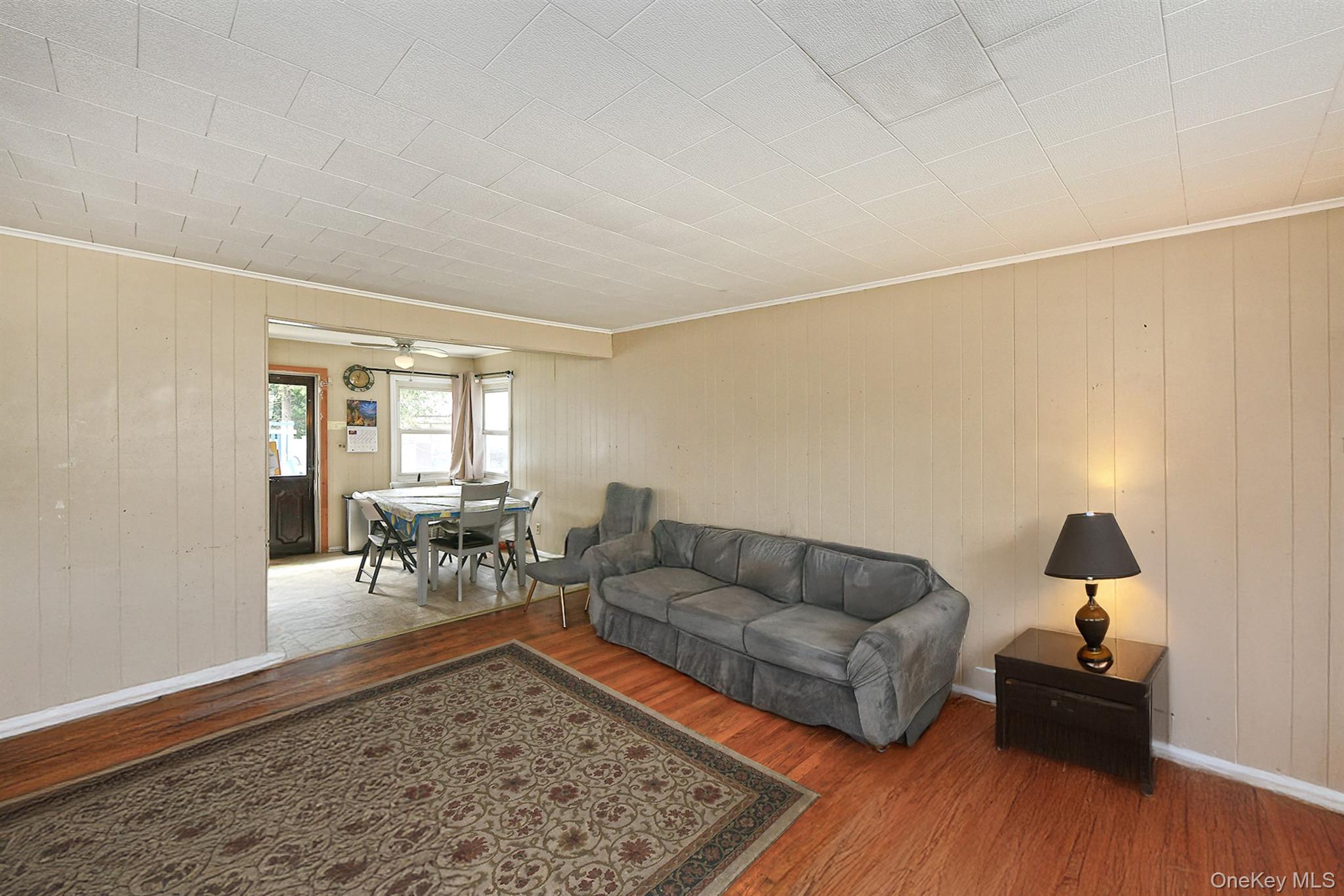 25 Lincoln Road North Plainview, NY 11803 - Photo 5 of 13 a living room with furniture and a wooden floor