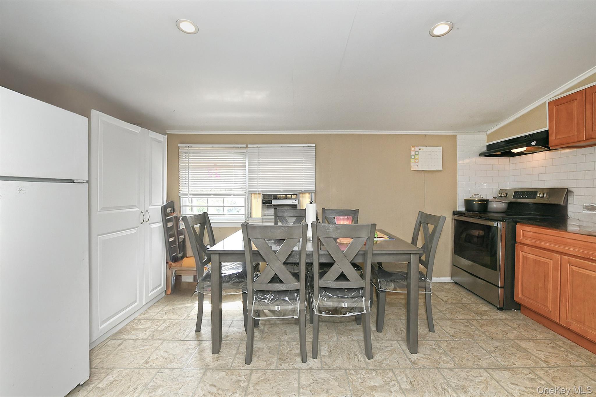 25 Lincoln Road North Plainview, NY 11803 - Photo 8 of 13 a view of a dining room with furniture