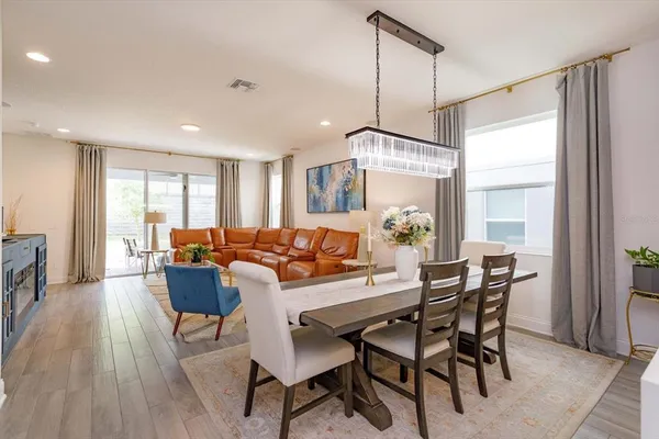 a view of a dining room with furniture window and outside view
