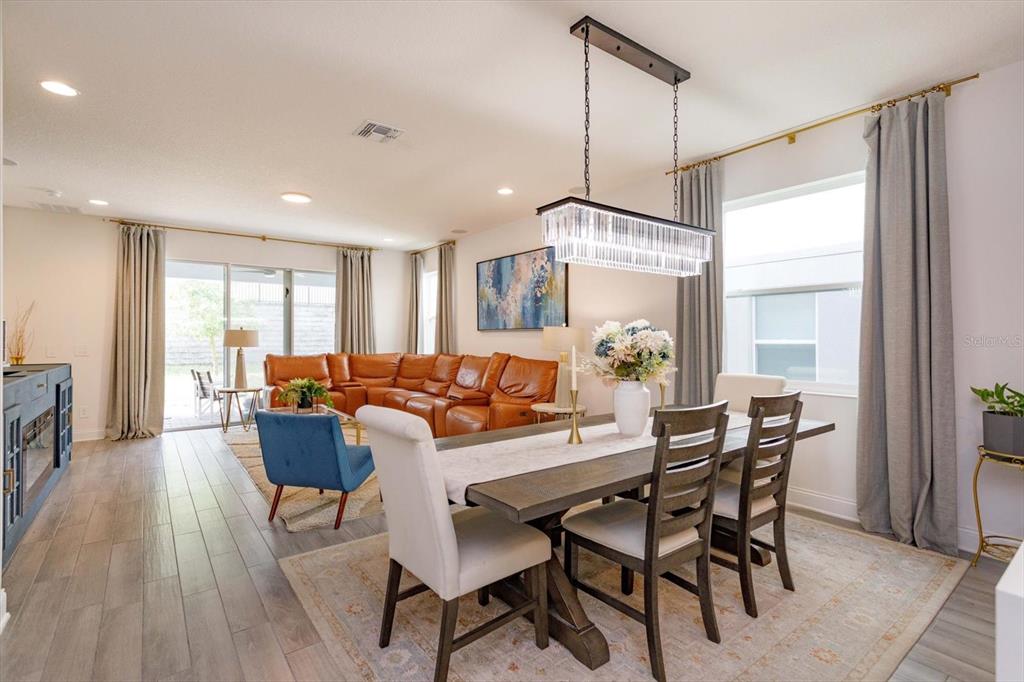 1231 Foltz Loop Oakland, FL 34787 - Photo 11 of 30 a view of a dining room with furniture window and outside view