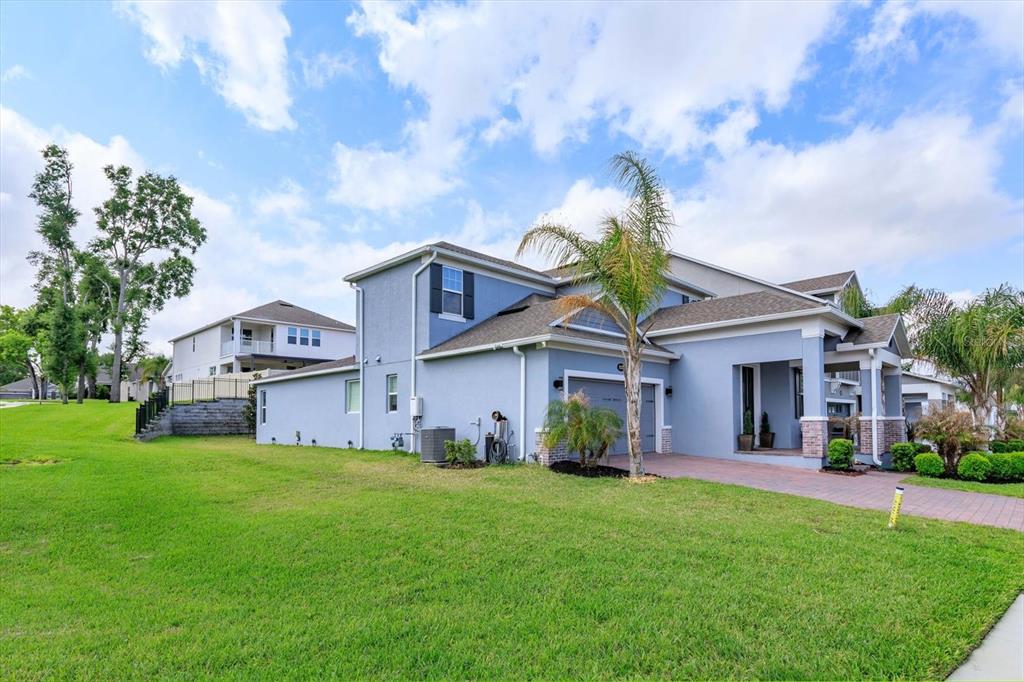 1231 Foltz Loop Oakland, FL 34787 - Photo 2 of 30 a front view of house with yard and green space