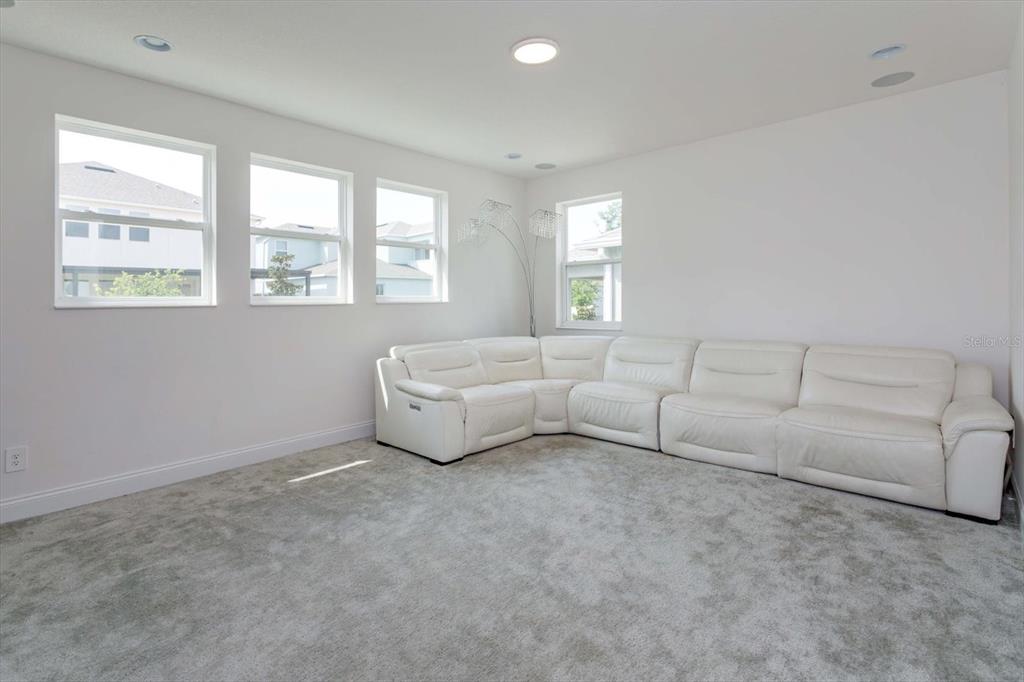 1231 Foltz Loop Oakland, FL 34787 - Photo 25 of 30 a living room with furniture and a window