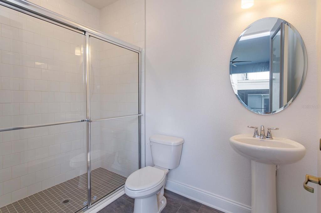 1231 Foltz Loop Oakland, FL 34787 - Photo 26 of 30 a bathroom with a sink toilet and a mirror