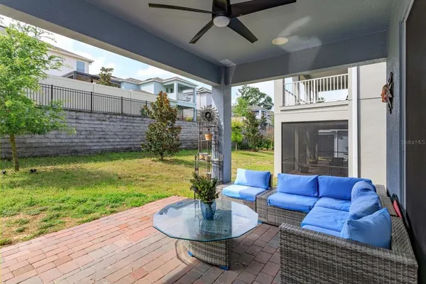 a view of a patio filled with furniture
