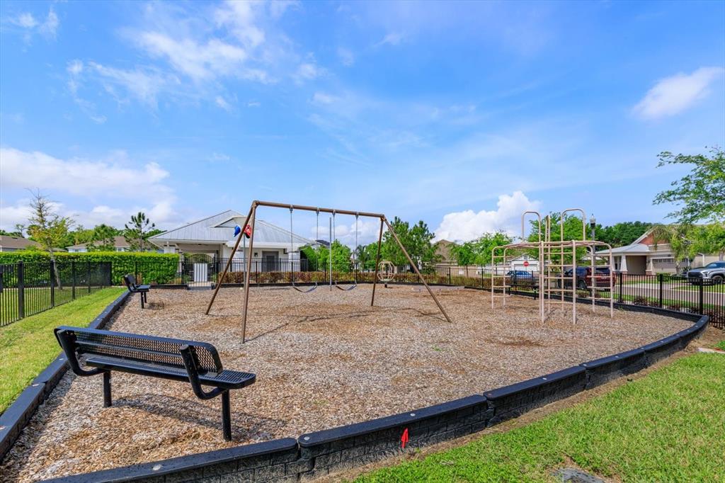 1231 Foltz Loop Oakland, FL 34787 - Photo 30 of 30 a park view with a bench and a slide