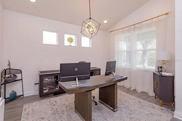 a view of a workspace with furniture