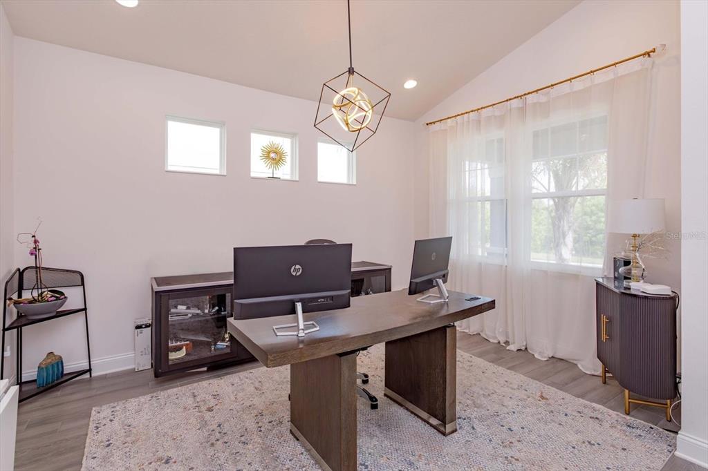 1231 Foltz Loop Oakland, FL 34787 - Photo 4 of 30 a view of a workspace with furniture