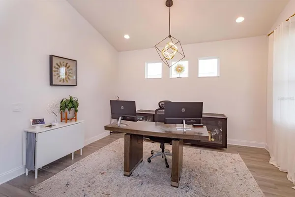 a view of a workspace with furniture