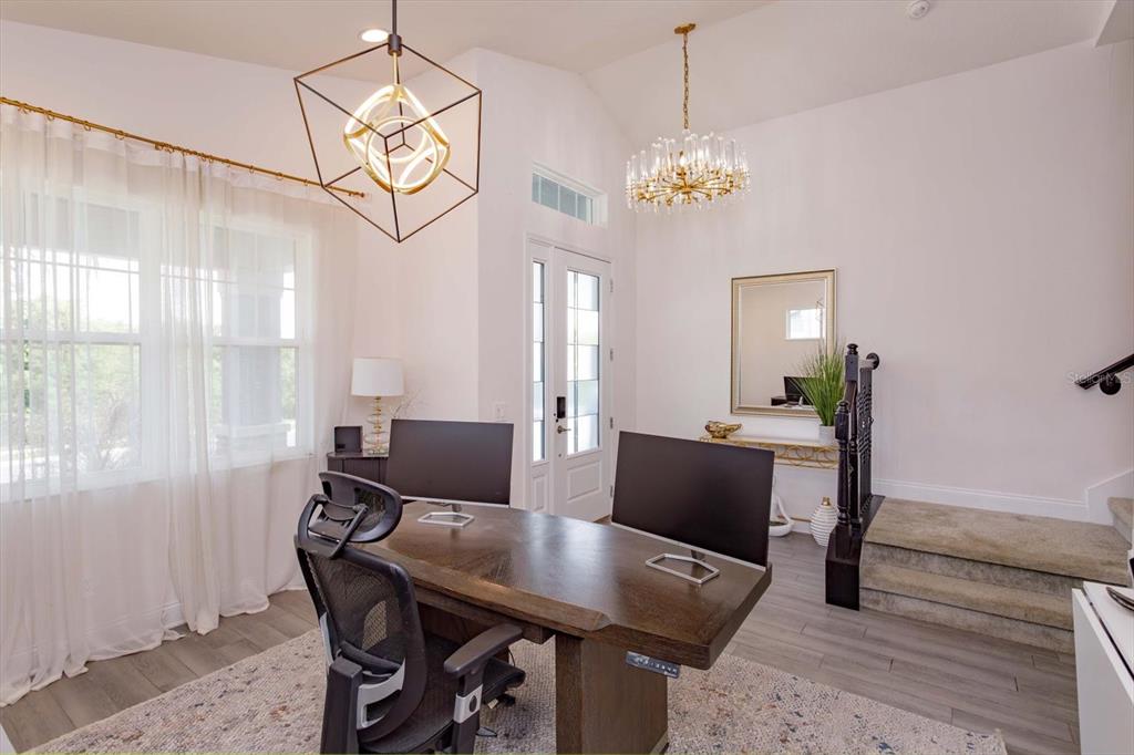 1231 Foltz Loop Oakland, FL 34787 - Photo 6 of 30 a view of a dining room with furniture and chandelier
