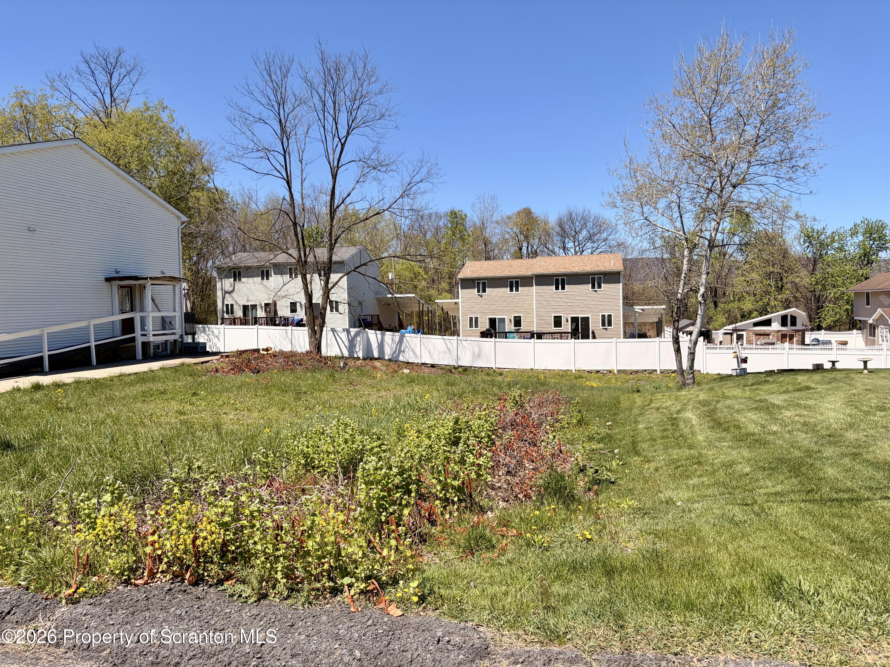 a view of a house with outdoor space and sitting area