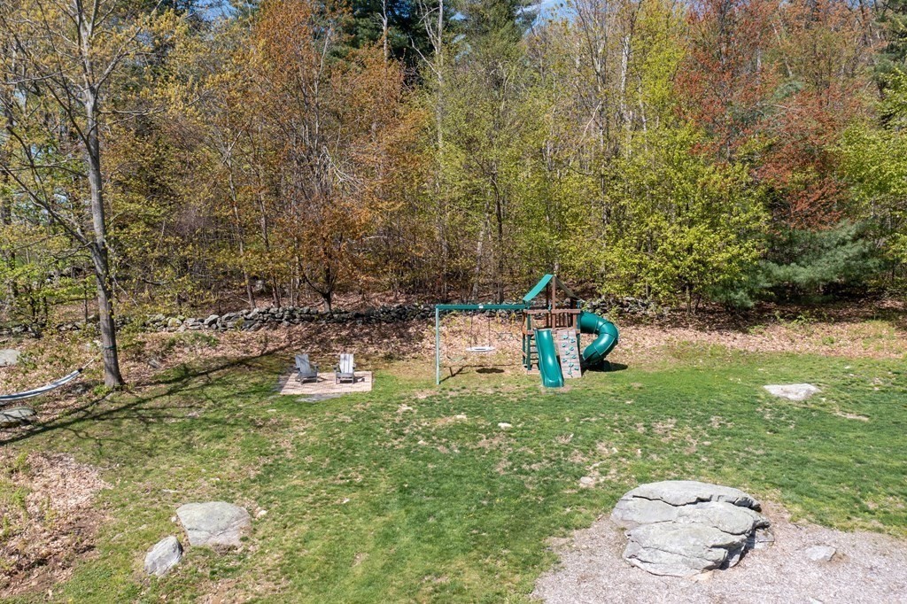 235 Mirick Road Princeton, MA 01541 - Photo 36 of 42 a backyard of a house with seating space