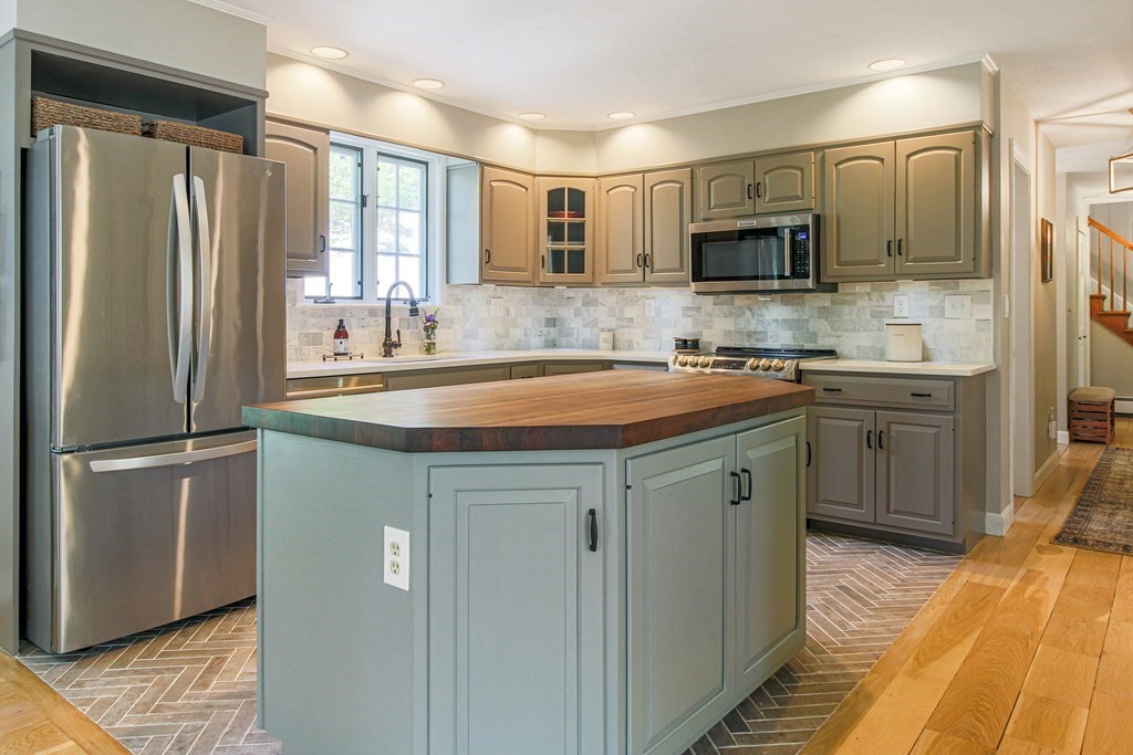 235 Mirick Road Princeton, MA 01541 - Photo 5 of 42 a kitchen with stainless steel appliances a sink stove refrigerator and cabinets