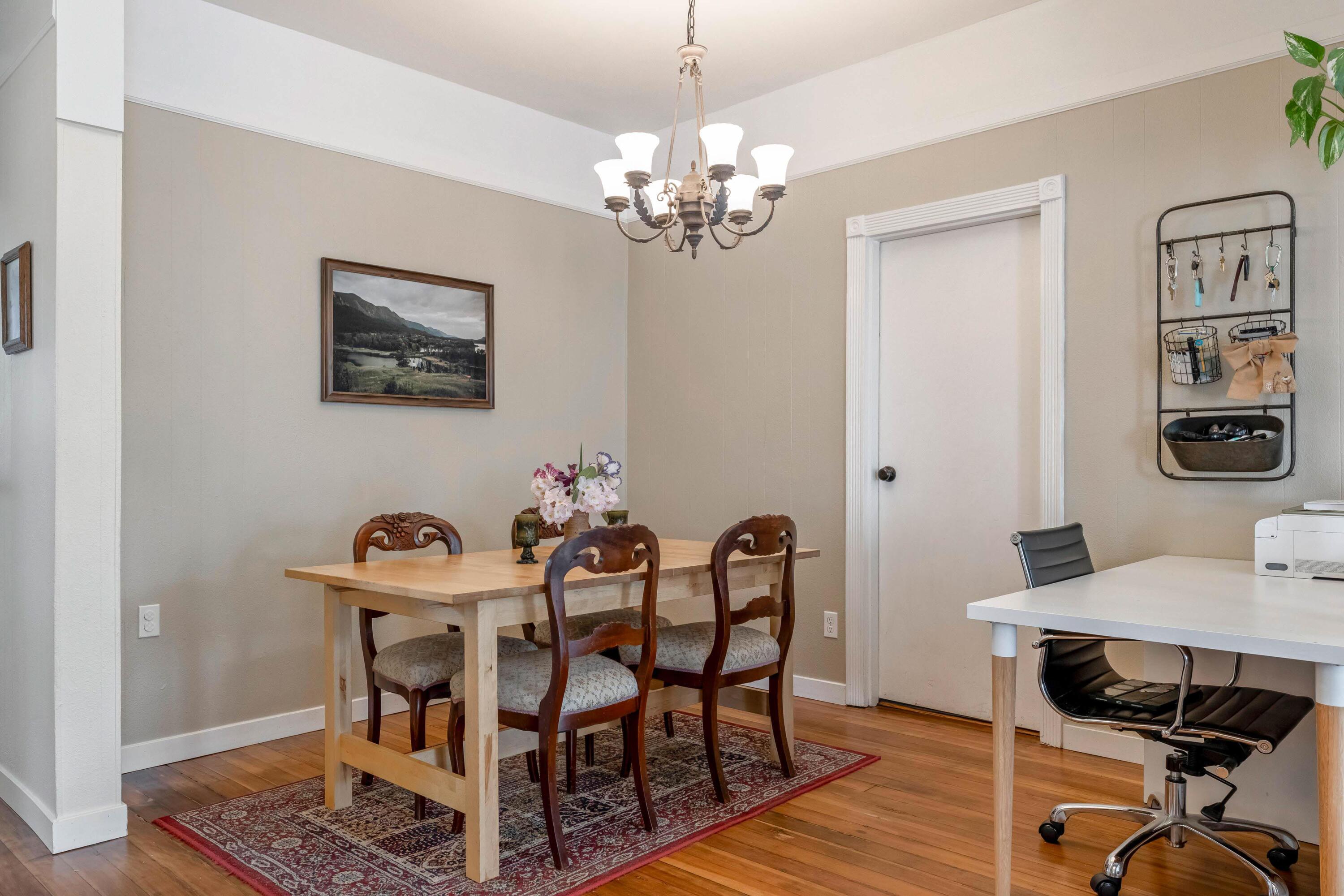 496 Southwest 2nd Street Madras, OR 97741 - Photo 11 of 37 a view of a dining room with furniture and wooden floor