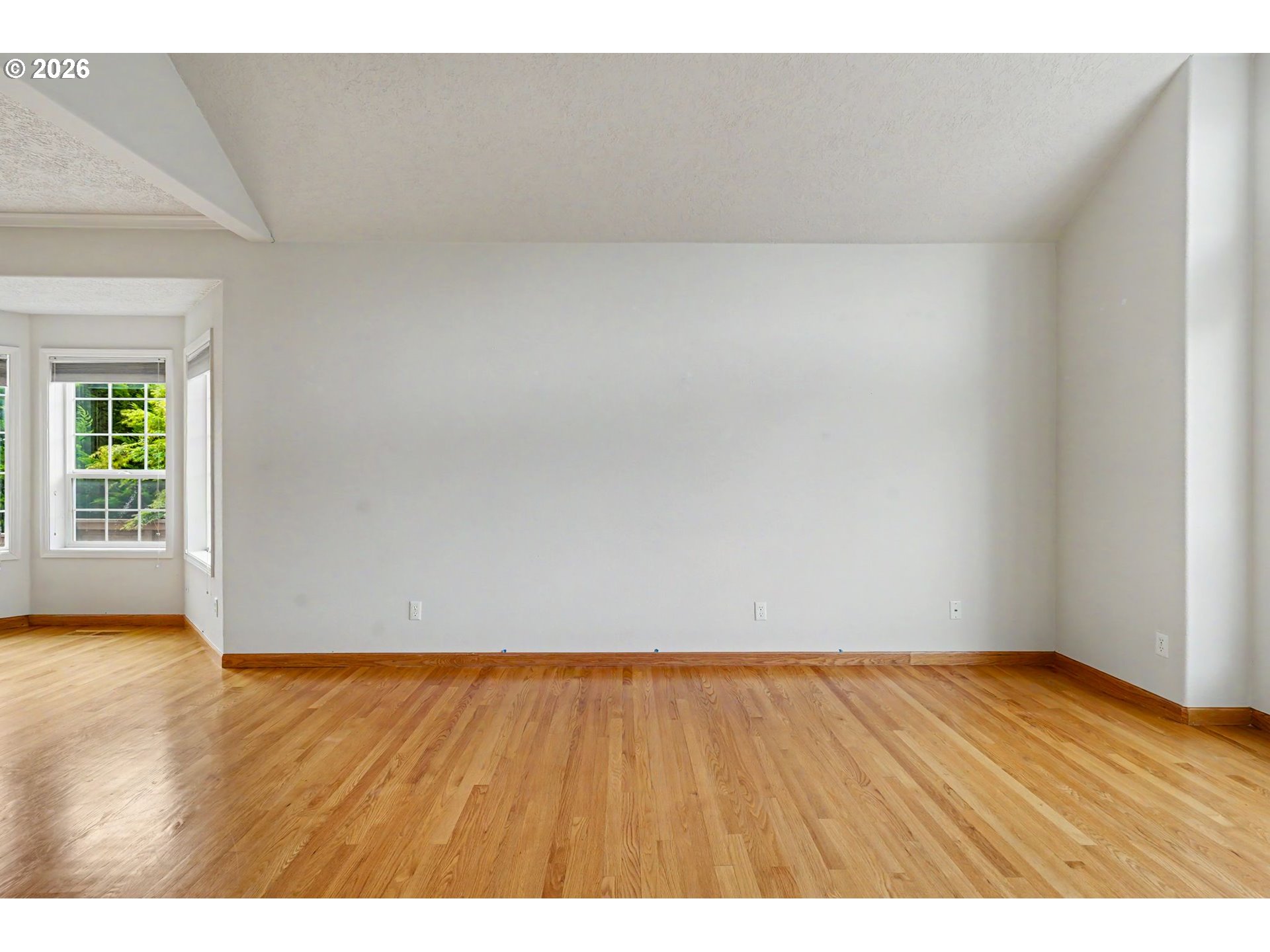 1470 Ranier Loop Northwest Salem, OR 97304 - Photo 9 of 48 a view of an empty room and wooden floor