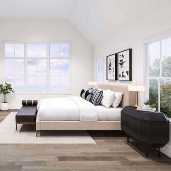 a bedroom with a bed and a couch