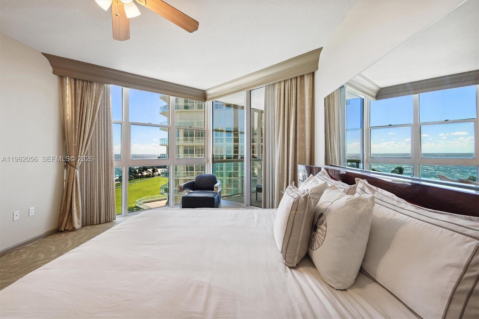 Hollywood Hollywood, FL 33019 - Photo 10 of 31 a bed sitting in a bedroom next to a window