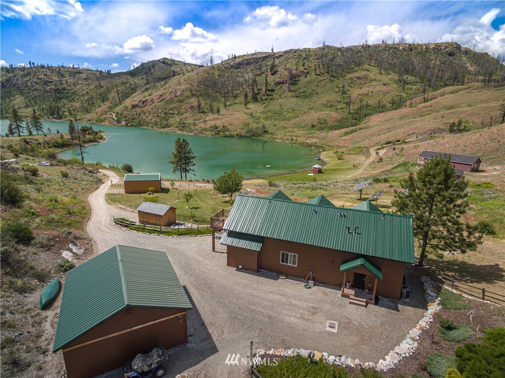 28 Alkali Lake Road Riverside, WA 98849 - Photo 1 of 35 an aerial view of a house with a garden