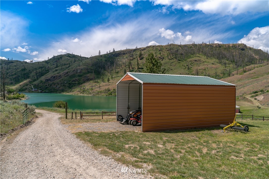 28 Alkali Lake Road Riverside, WA 98849 - Photo 14 of 35 a backyard of a house with a yard and mountain view