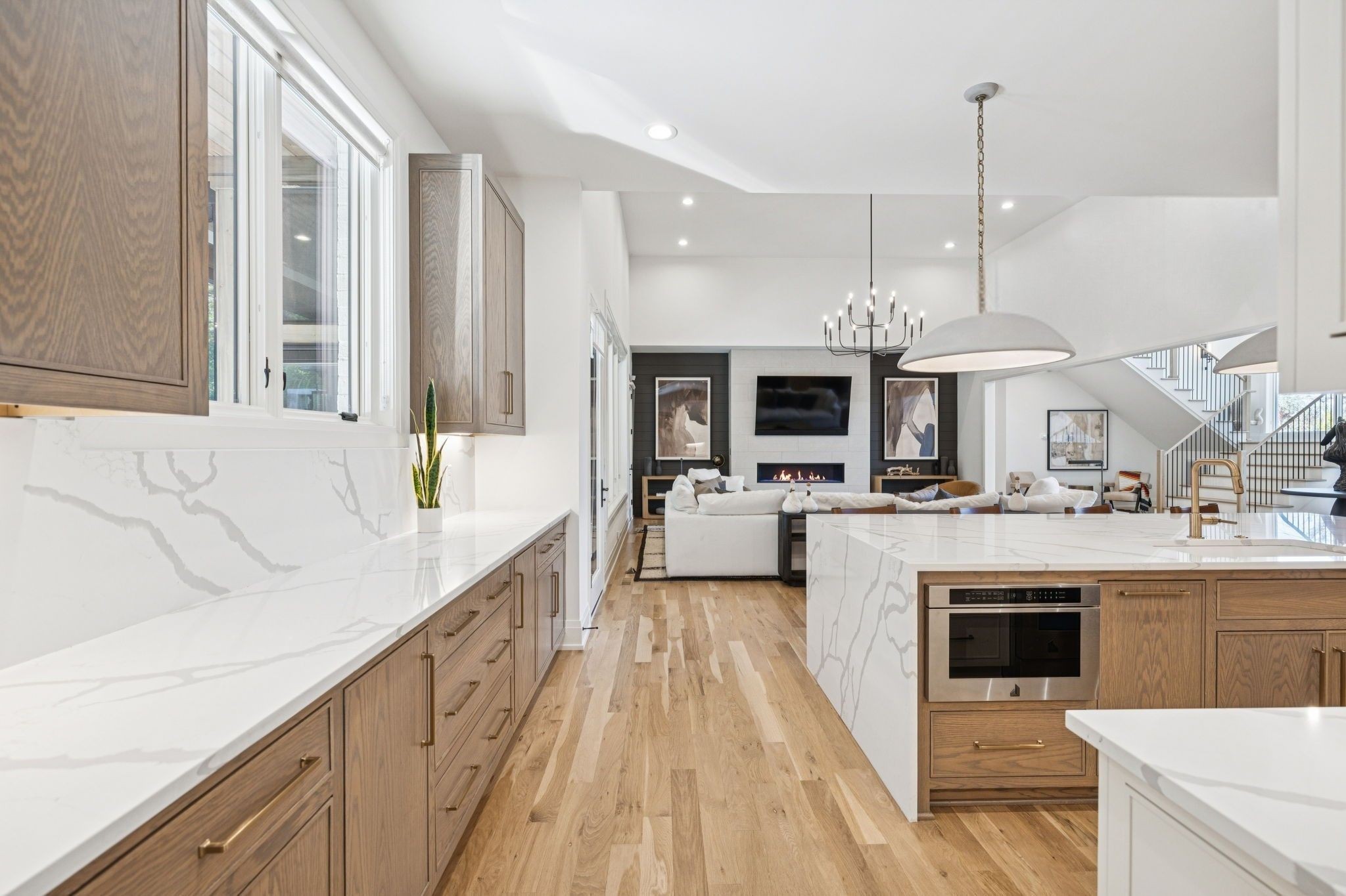 1323 Harding Place Nashville, TN 37215 - Photo 19 of 95 a large kitchen with stainless steel appliances kitchen island granite countertop a sink and cabinets