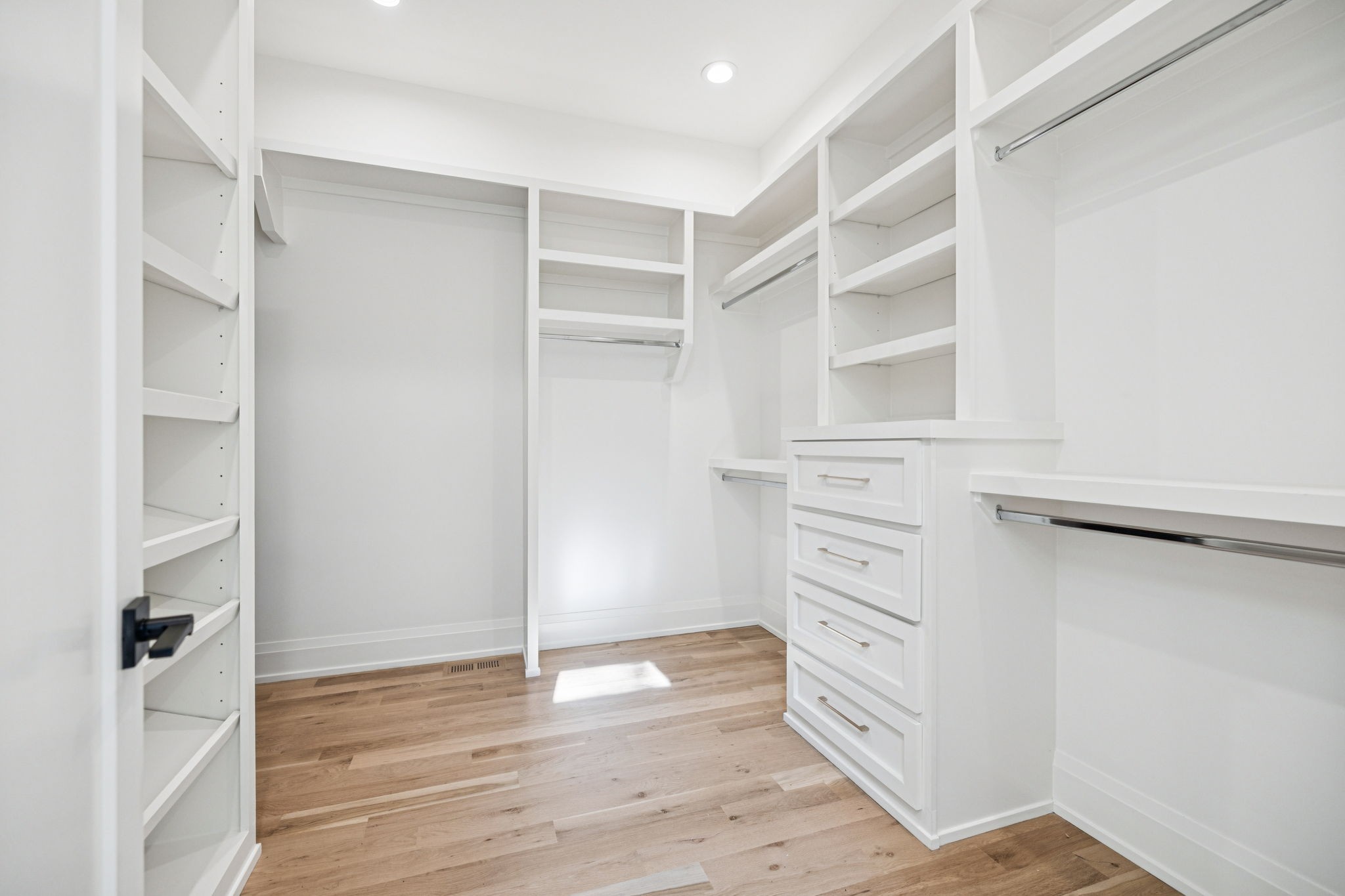 1323 Harding Place Nashville, TN 37215 - Photo 40 of 95 a view of walk in closet with empty racks