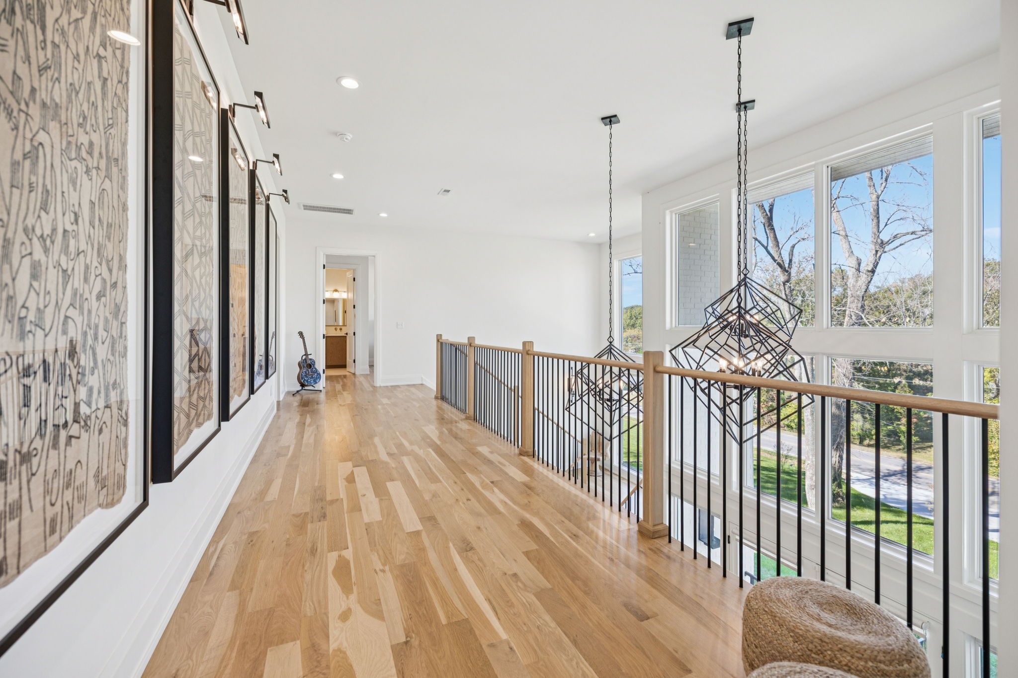 1323 Harding Place Nashville, TN 37215 - Photo 49 of 95 a view of a hallway with wooden floor and windows