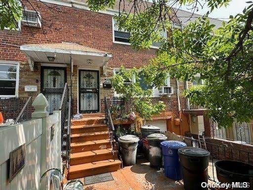 a view of a patio with table and chairs potted plants and a large tree