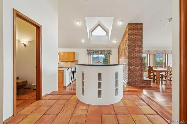 a bedroom with furniture and a mirror