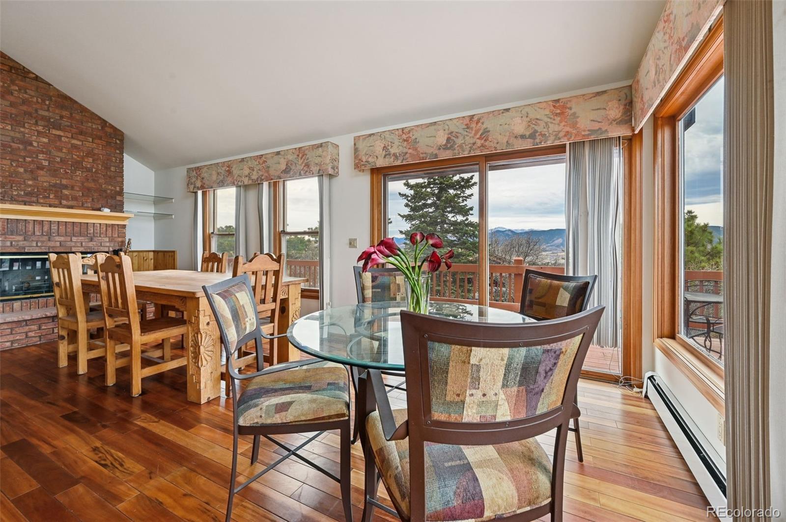 17580 Chipped Arrow Way Monument, CO 80132 - Photo 24 of 47 a view of a dining room with furniture window and outside view