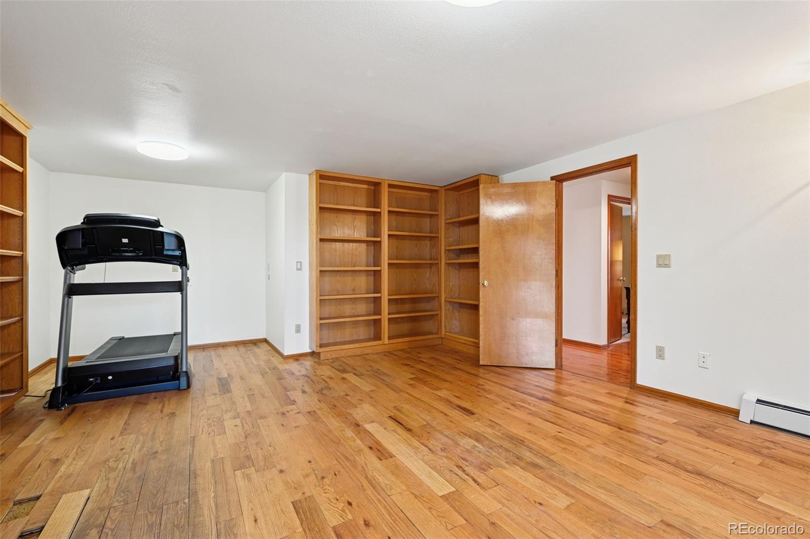 17580 Chipped Arrow Way Monument, CO 80132 - Photo 43 of 47 an empty room with wooden floor and closet